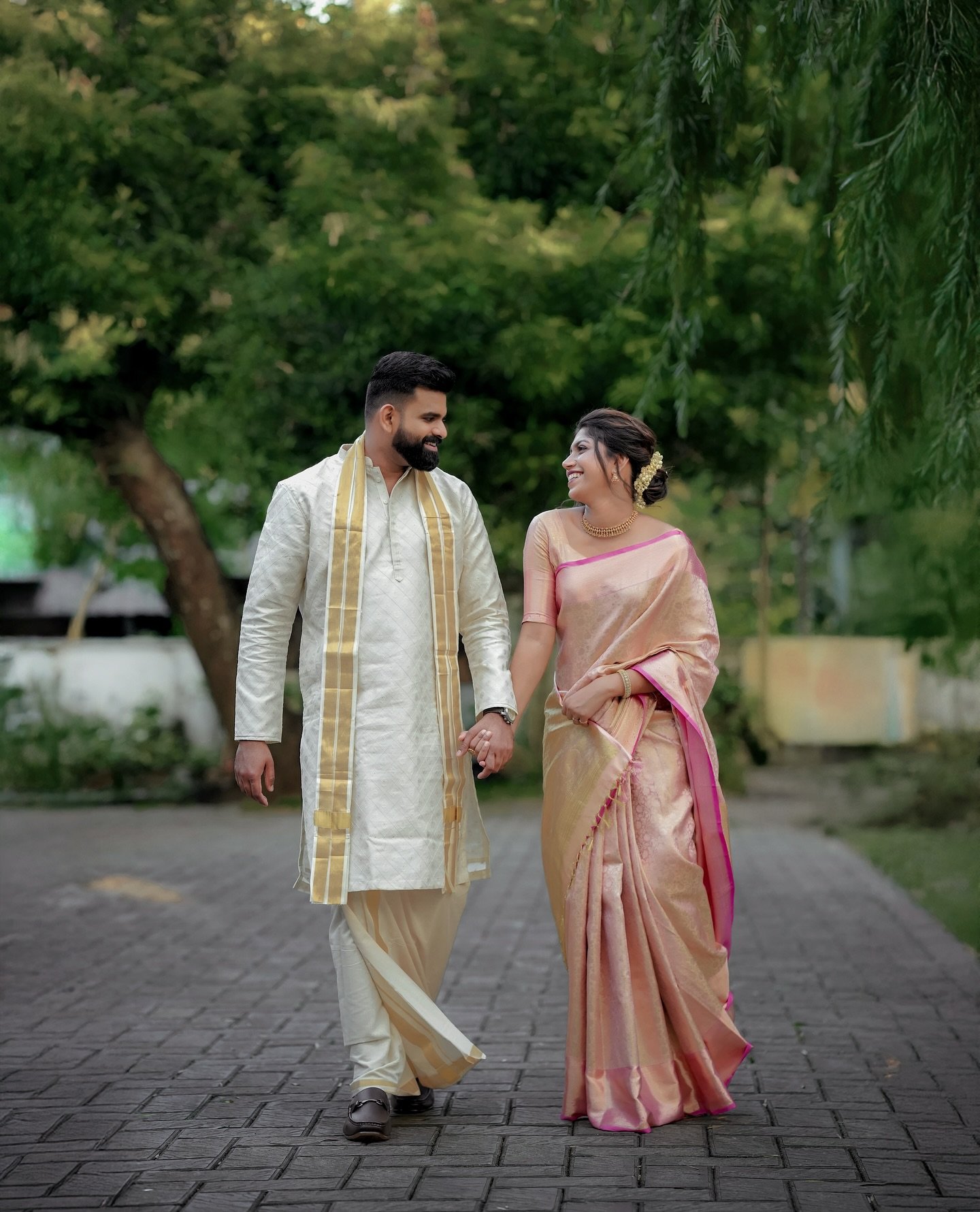 Couple walking together in traditional wedding attire